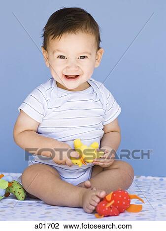 Baby playing with toys. View Large Photo Image Stock Image - Baby playing with toys.. Fotosearch