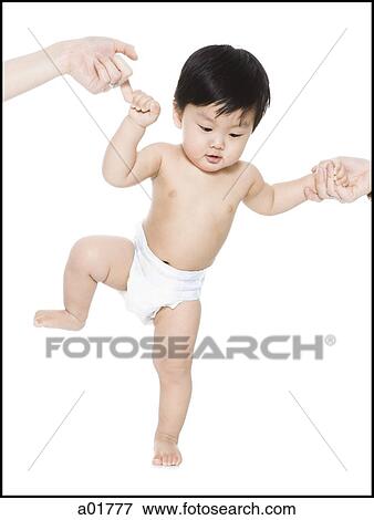 Stock Photo - baby's first steps. Fotosearch