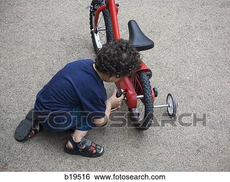 boy fixing his bike View Large Photo Image Stock Photograph - boy fixing his bike. Fotosearch