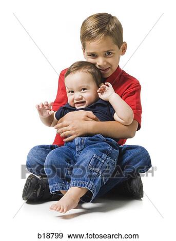 boy holding a baby boy. View Large Photo Image Stock Photo - boy holding a baby boy.. Fotosearch