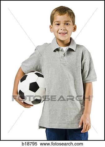 Boy holding a soccer ball. View Large Photo Image Stock Photography - Boy holding a soccer ball.. Fotosearch
