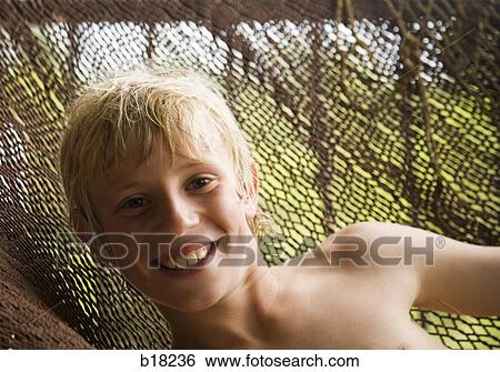 Boy in a hammock. View Large Photo Image Stock Photograph - Boy in a hammock.. Fotosearch