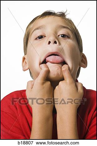 boy in a red shirt making a face. View Large Photo Image Stock Photo - boy in a red shirt making a face.. Fotosearch