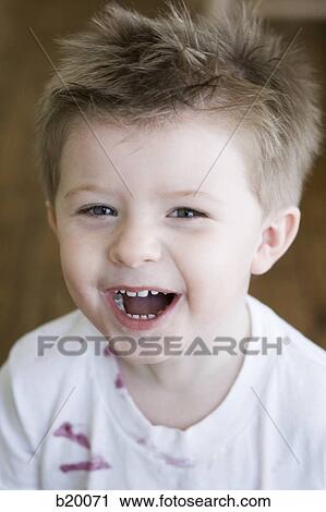 Stock Image - boy laughing. Fotosearch