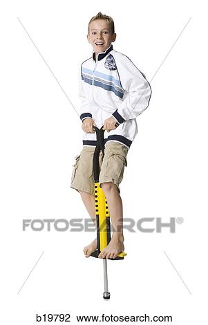 boy on a pogo stick View Large Photo Image Stock Image - boy on a pogo stick. Fotosearch