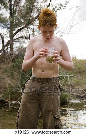 boy playing in a river. View Large Photo Image Stock Photograph - boy playing in a river.. Fotosearch