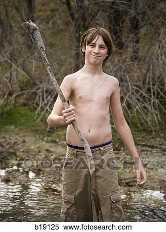 boy playing with a stick. View Large Photo Image Stock Photography - boy playing with a stick.. Fotosearch