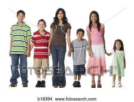 Brothers and sisters standing together. View Large Photo Image Picture - Brothers and sisters standing together.. Fotosearch