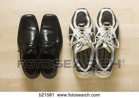 Stock Image - business shoes and athletic shoes. Fotosearch