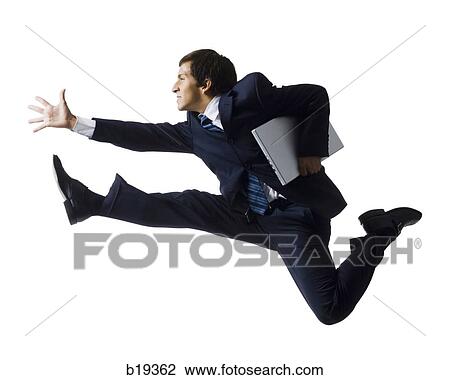 Stock Image - businessman jumping in the air. Fotosearch