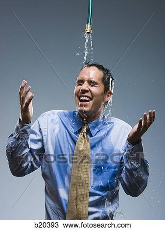 businessman standing under a hose View Large Photo Image Stock Image - businessman standing under a hose. Fotosearch