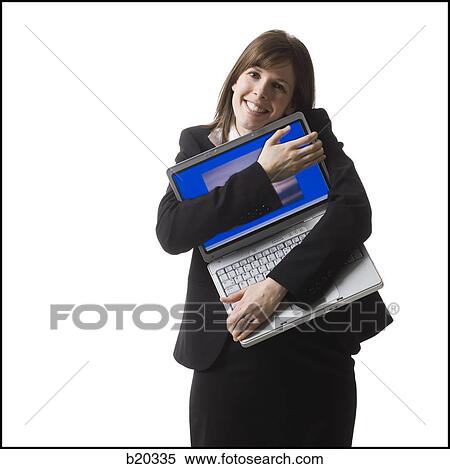 Stock Photography - businessperson holding a laptop computer. Fotosearch