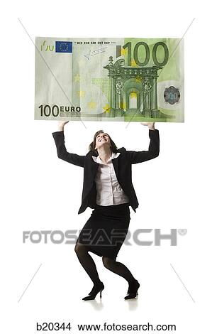 businessperson holding up a bank note View Large Photo Image Picture - businessperson holding up a bank note. Fotosearch