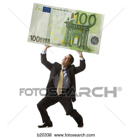 businessperson holding up a bank note View Large Photo Image Stock Photo - businessperson holding up a bank note. Fotosearch