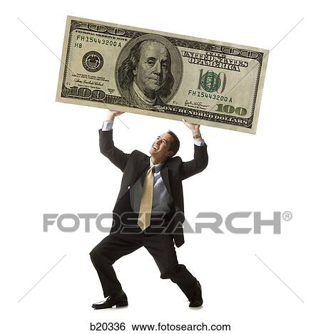 businessperson holding up a bank note View Large Photo Image Stock Photograph - businessperson holding up a bank note. Fotosearch