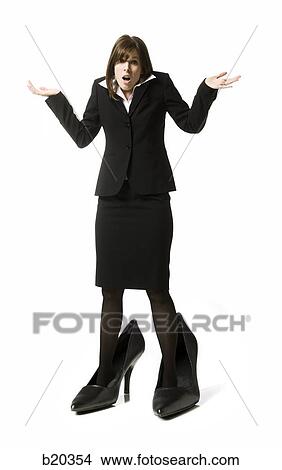 Picture - businessperson in big shoes. Fotosearch