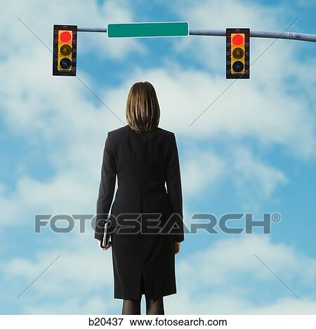 businessperson standing at a traffic signal View Large Photo Image Stock Photo - businessperson standing at a traffic signal. Fotosearch