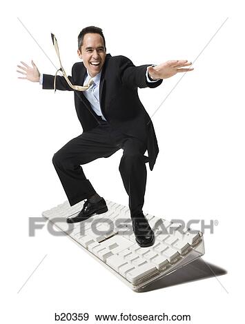businessperson surfing on a keyboard View Large Photo Image Stock Photo - businessperson surfing on a keyboard. Fotosearch