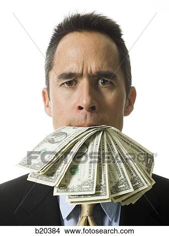 businessperson with a mouth full of money View Large Photo Image Picture - businessperson with a mouth full of money. Fotosearch