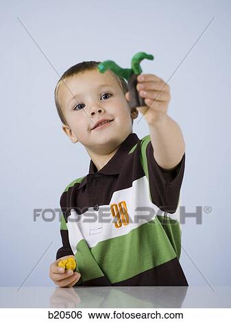 Stock Photograph - Caucasian Appearance, Clay, One Person, One Boy Only, 4-5 years. Fotosearch