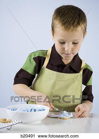 Stock Image - child baking. Fotosearch