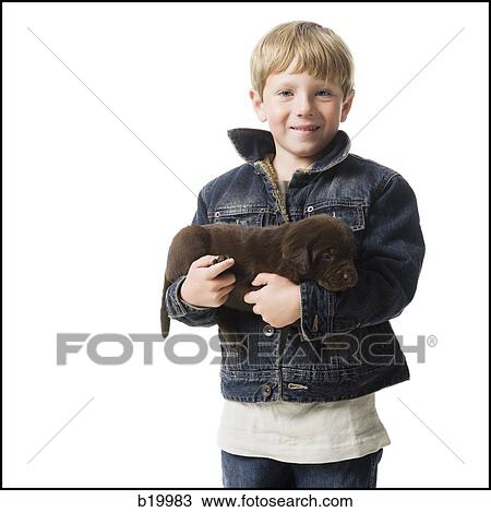 Stock Image - child with a puppy. Fotosearch