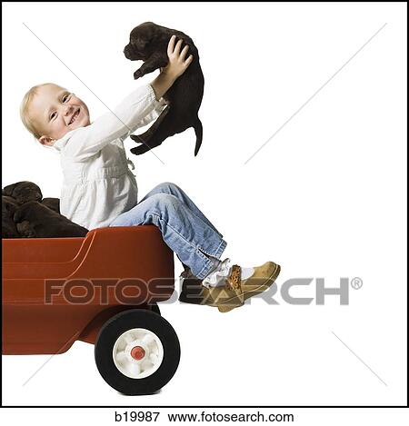 Stock Photo - child with a puppy. Fotosearch