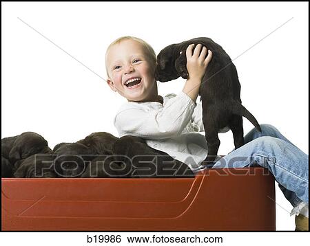Stock Photograph - child with a puppy. Fotosearch