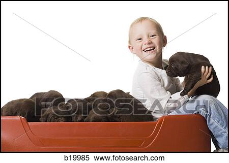Stock Photography - child with a puppy. Fotosearch
