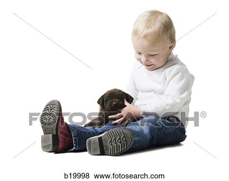 child with puppy View Large Photo Image Stock Photo - child with puppy. Fotosearch