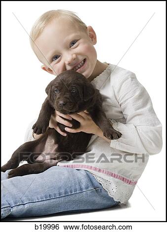 Stock Photograph - child with puppy. Fotosearch