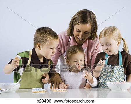 Stock Photograph - children baking. Fotosearch
