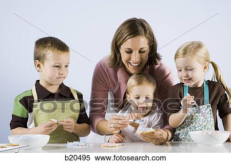 Stock Photography - children baking. Fotosearch