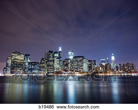 Stock Photograph - city at night on the water. Fotosearch