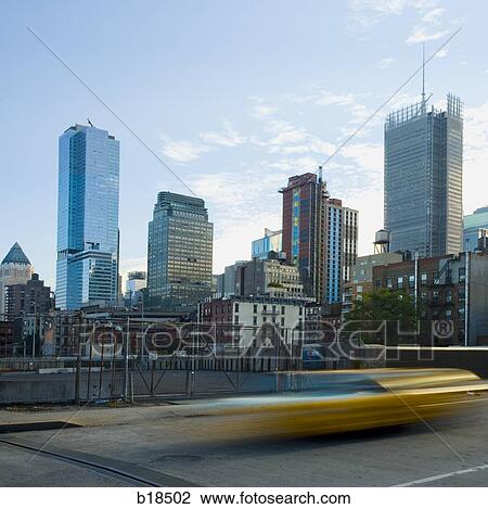 cityscape with blurred car in foreground. View Large Photo Image Stock Image - cityscape with blurred car in foreground.. Fotosearch