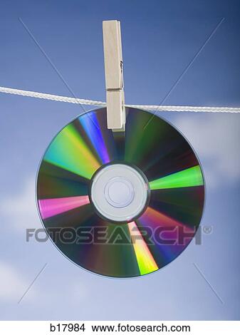 Compact disc hung out to dry. View Large Photo Image Picture - Compact disc hung out to dry.. Fotosearch