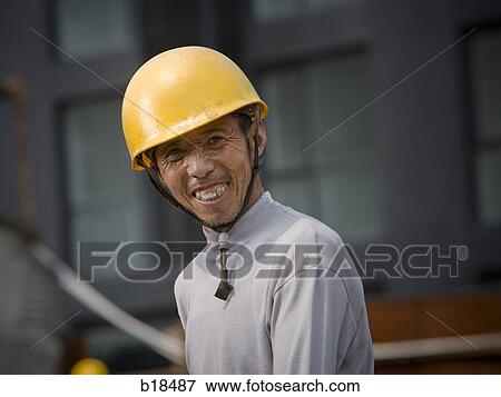 Construction worker on a job site. View Large Photo Image Stock Photo - Construction worker on a job site.. Fotosearch