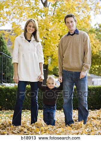 couple and their baby holding hands. View Large Photo Image Stock Image - couple and their baby holding hands.. Fotosearch