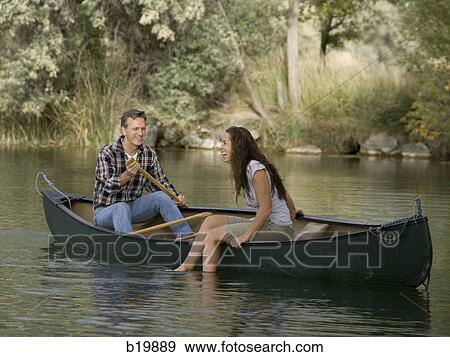 Stock Photo - couple in a canoe. Fotosearch