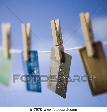 Stock Photo - Credit cards hung out to dry.. Fotosearch