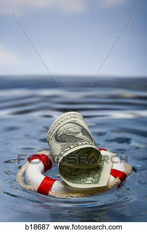 Stock Photo - Dollar in a life preserver.. Fotosearch