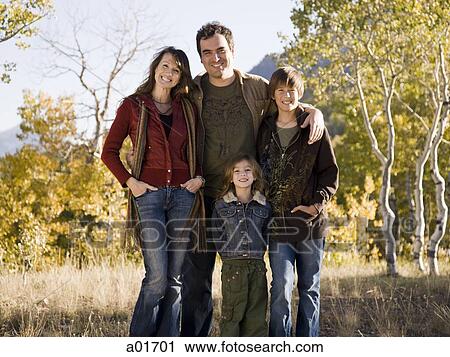 "Family of four, outdoors. " View Large Photo Image Stock Image - "Family of four, outdoors. ". Fotosearch