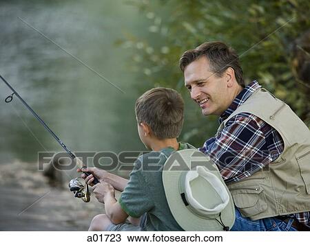 Stock Image - Father and son going fishing.. Fotosearch