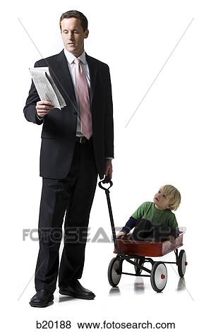father reading a newspaper View Large Photo Image Stock Photo - father reading a newspaper. Fotosearch