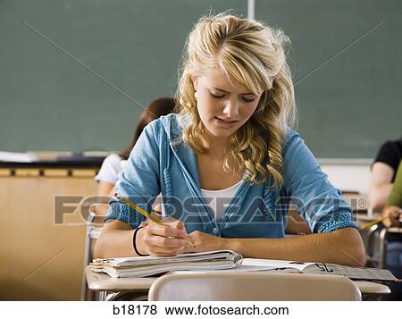 Stock Photo - Femail Student in a classroom.. Fotosearch