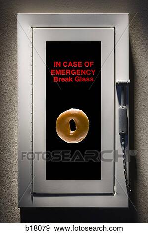 Stock Photo - Fire alarm with a bagel inside.. Fotosearch