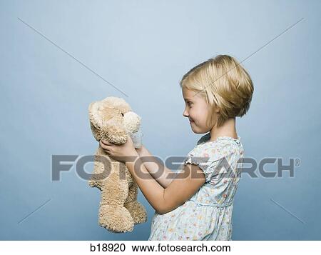 Stock Image - girl hugging teddy bear.. Fotosearch