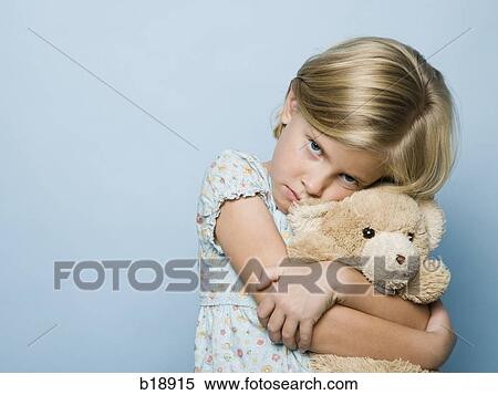 Stock Photography - girl hugging teddy bear.. Fotosearch