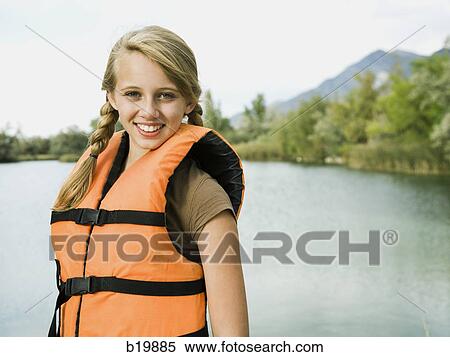 Stock Photography - girl in a life vest. Fotosearch