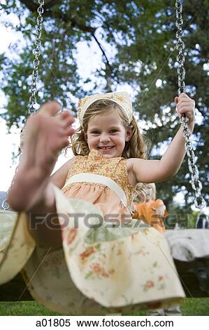 girl on a swing View Large Photo Image Stock Photography - girl on a swing. Fotosearch